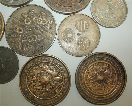 A large collection of Japanese bronze hand mirrors, 19th century, 7.6cm